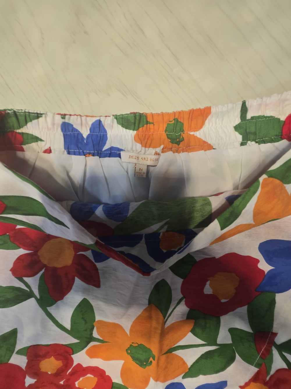 Skies Are Blue White Midi Skirt with Red, Blue, Orange & Green Floral Print - Picture 3 of 4